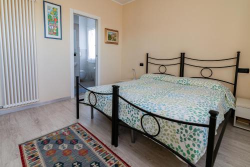 a bedroom with a bed in a room with a rug at B&B Villa Lattes in Vicenza