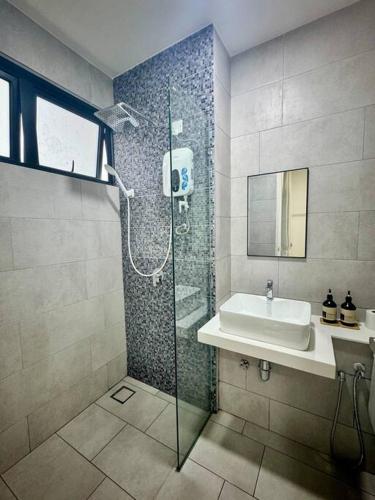 a bathroom with a shower and a sink at The Shore Suite seaview balcony Free Wifi & Netflix in Kota Kinabalu