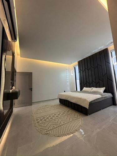 Cama o camas de una habitación en شاليه الغزل