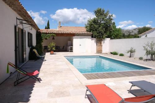 charming vacation rental with heated pool at the foot of the alpilles, in aureille, close to the center of the village on foot, sleeps 6/8 people in provence.