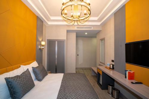 a hotel room with a bed and a television at Icon Hotel Bomonti in Istanbul