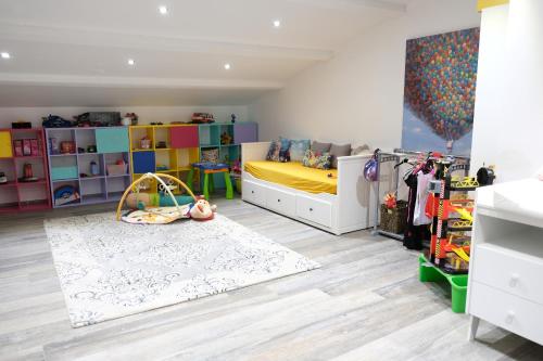 a bedroom with a yellow bed and a white rug at charming villa with heated pool, 14 people, located in aureille, near les baux de provence, in the alpilles in Aureille