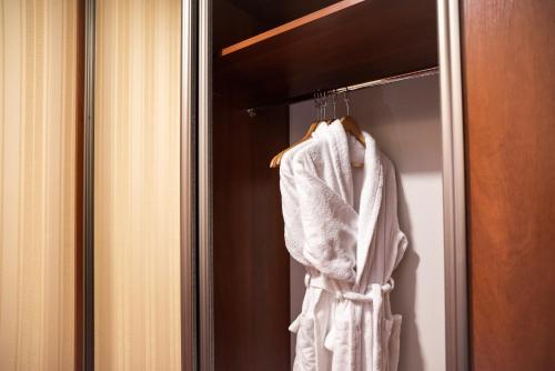 a towel hanging on a door in a bathroom at Solva Resort Medical & SPA in Polyana