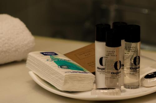 a plate with two rolls of toilet paper on a counter at Hotel Principe Real in Lisbon