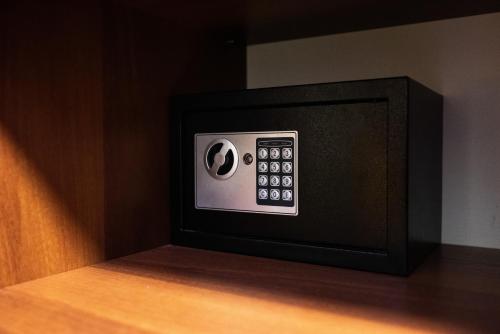 a microwave oven with a control panel on a table at Solva Resort Medical & SPA in Polyana