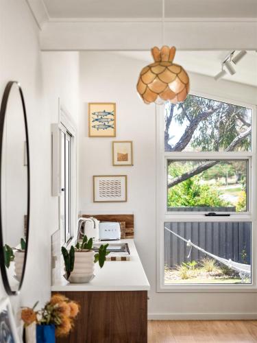 a kitchen with a sink and a window at Stylish Shack Falcon Bay in Wannanup