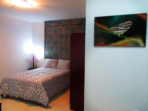 Ένα ή περισσότερα κρεβάτια σε δωμάτιο στο Magicperu Apart Hotel