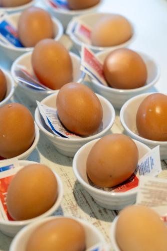 a bunch of eggs in bowls on a table at Club del Sole Adriano Family Collection in Punta Marina