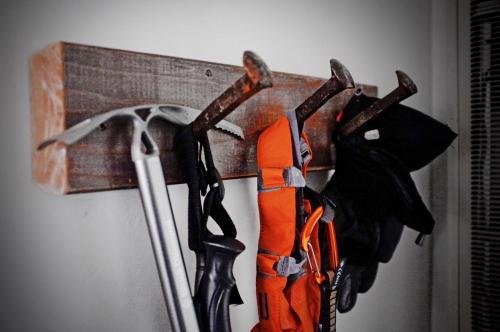 a rack of ties hanging from a wall at Basecamp Tahoe City in Tahoe City
