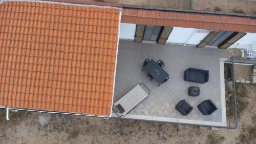an overhead view of a building with benches and tables at A Casa di Elsa in Sonnino