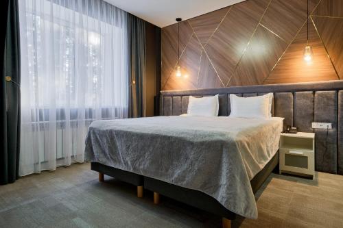 Кровать или кровати в номере Aisha Bibi Hotel & Spa Burabay