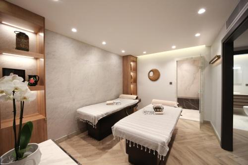 a spa room with two beds and a shower at Me by Mula in Istanbul