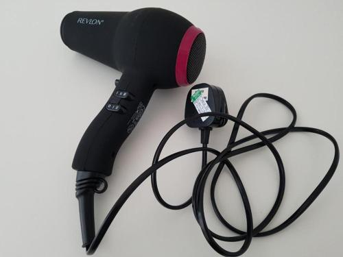 a microphone on a white surface with a cord at Portsmouth House near Centre 3 Bedrooms in Portsmouth