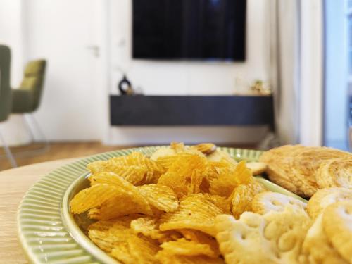 a plate of food on a table with bread at Klein und fein mit Whirlpool in Burgwedel