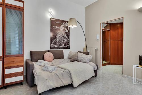 a living room with a couch and a table at Grace House Navigli in Milan
