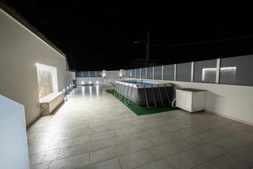 a room with a table and benches in a building at Villa Lumia in Tre Fontane