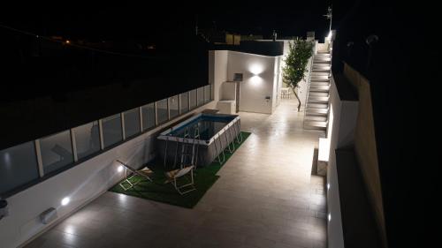 an overhead view of a pool on a building at night at Villa Lumia in Tre Fontane