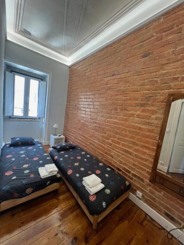 Postel nebo postele na pokoji v ubytování Angels Homes n.27 1ºandar, Bairro tipico, Centro cidade