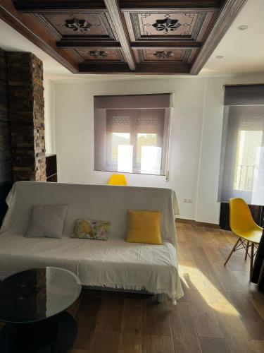 a living room with a couch and a table at Apartamento rural Julio in Trevélez