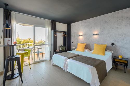 Ένα ή περισσότερα κρεβάτια σε δωμάτιο στο Apartamentos Vibra Jabeque Dreams