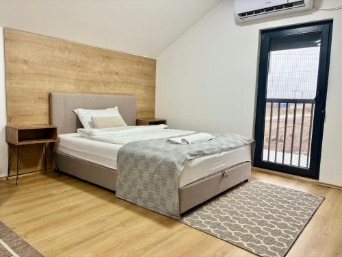 Postel nebo postele na pokoji v ubytování Promo Studio Apartment