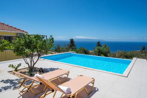 a villa with a swimming pool with a view at Villa Onera in Vlachata