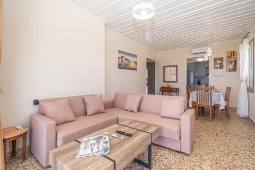 a living room with a couch and a table at Villa Onera in Vlachata