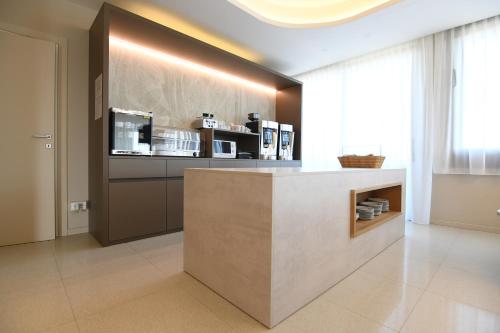 a kitchen with a counter and a counter top at Albergo Grappolo D'oro in Montebelluna