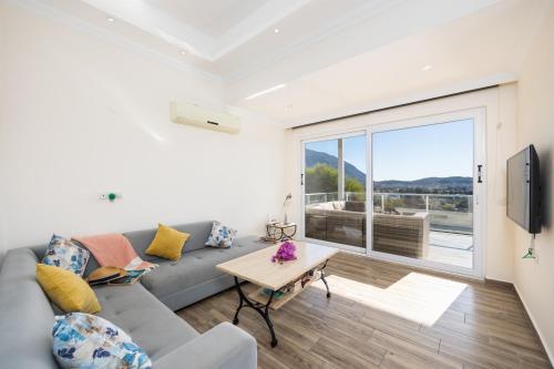 a living room with a couch and a table at Residence Villa 1 in Oludeniz