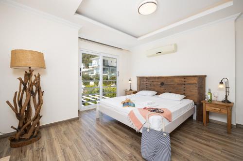 a bedroom with a large bed and a window at Residence Villa 1 in Oludeniz
