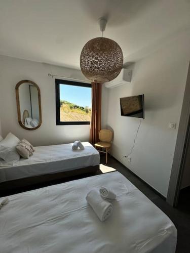 Giường trong phòng chung tại Appartement neuf 6PERS Bel O