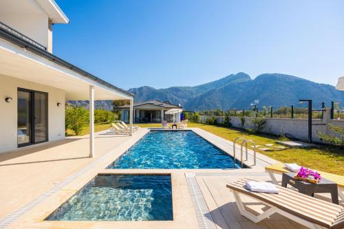 a swimming pool in the backyard of a house at Villa Funda in Dalyan
