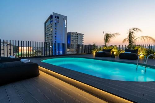 a swimming pool on the roof of a building at The Penthouse - 3BR Seaview with Private Pool in Larnaca in Larnaca