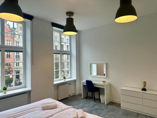 Posteľ alebo postele v izbe v ubytovaní Lunette Apartments - Długi Targ