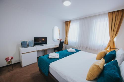 Postel nebo postele na pokoji v ubytování Hotel Brcko Gas Doboj