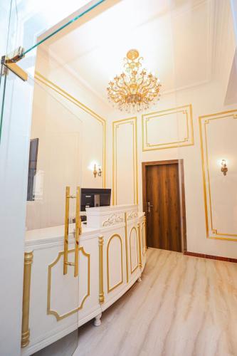 a large room with a chandelier and a vanity at Downtown Antique Hotel in Cairo