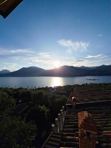a view of a body of water with mountains in the background at Casa antico borgo - appartamento 3 in Brenzone sul Garda