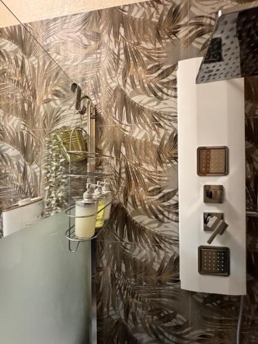 a bathroom with a shower with a wall at Verona green harmony in Verona