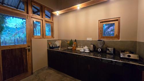 a kitchen with a counter top and a window at Whispering Wave Tangalle in Tangalle