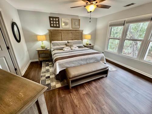 a bedroom with a bed and two windows at Lovely 3 Bed3 Bath Pet FriendlyVilla - Walk to the beach pools and tennis #75 Ocean Breeze in Hilton Head Island