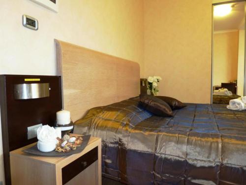 a bedroom with a large bed with a large mirror at EH Rome Airport Euro House Hotels in Fiumicino