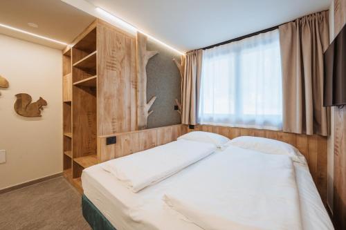 Postel nebo postele na pokoji v ubytování Residence Piz Aot