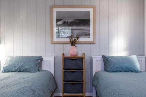 Ένα ή περισσότερα κρεβάτια σε δωμάτιο στο Beach House to chill Marcoola