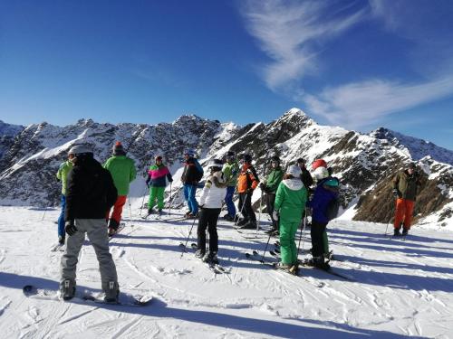 a group of people on skis on a snow covered mountain at Ferienwohnung im Zentrum von Kappl Nähe Ischgl PAZN102 by FeWo-PLAN in Kappl