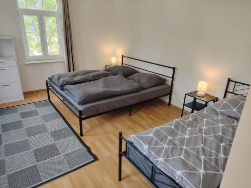 Postel nebo postele na pokoji v ubytování Ruhige Auszeit mit zentraler Anbindung