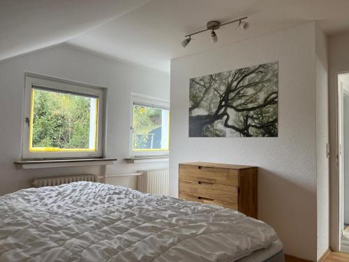 En eller flere senge i et værelse på Harzhaus Altenau - Wohnung 3