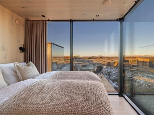 Postel nebo postele na pokoji v ubytování ÖÖD Hekla Horizon - Mirror Houses