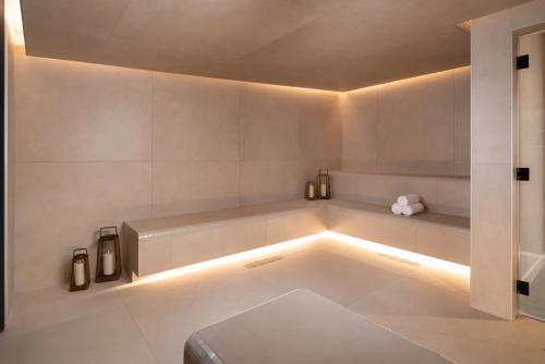 a bathroom with a tub with lights on the floor at New unit 28th Floor with Unbeatable Bayside Views in Miami