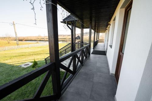 a porch of a house with a view of a field at Casa Andra in Siret