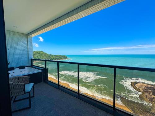 a room with a view of the ocean at Blue Sea Hotel in Itapema
